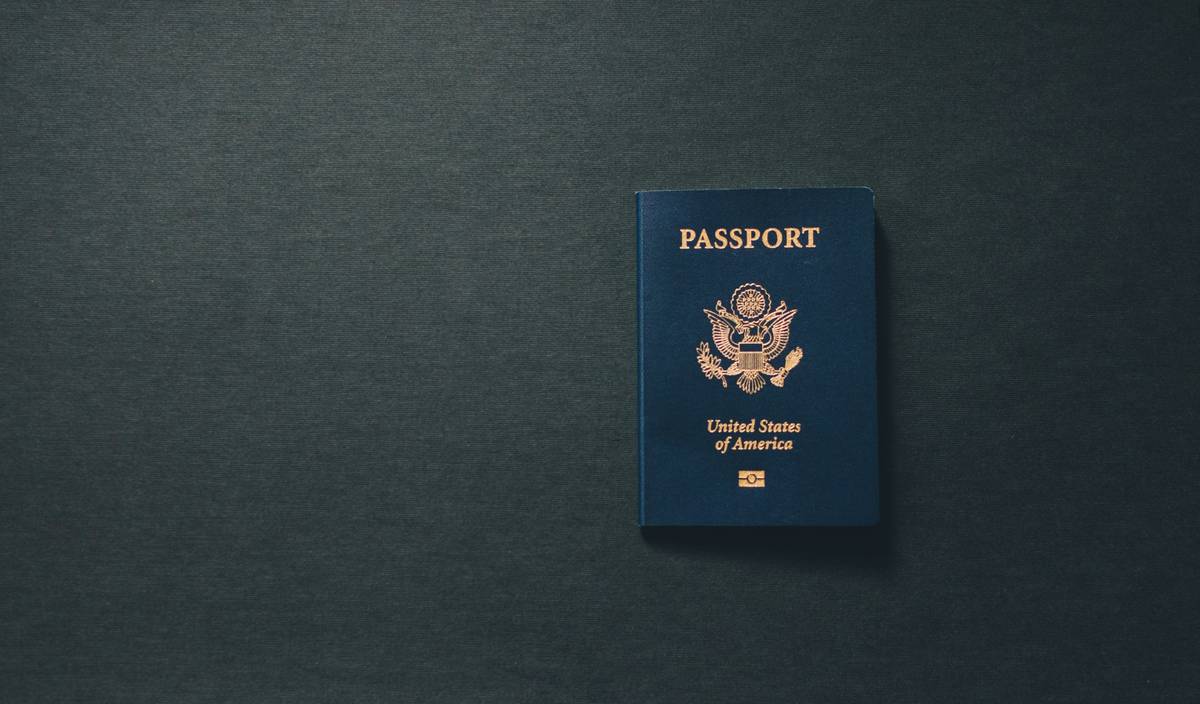 Woman holding a newly purchased outfit after filing a lost luggage claim
